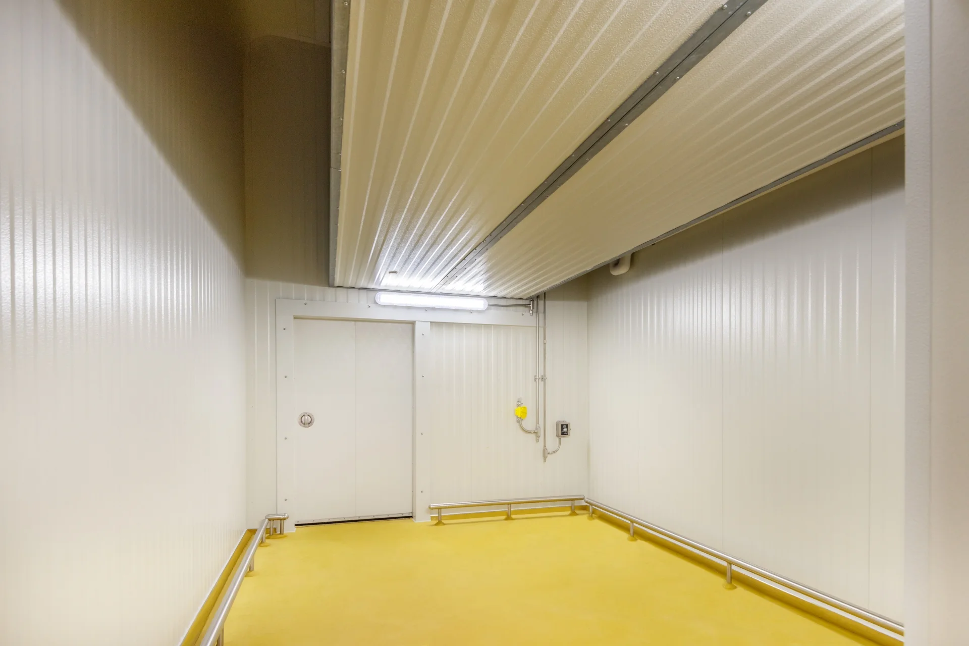 white cabinets and yellow floor