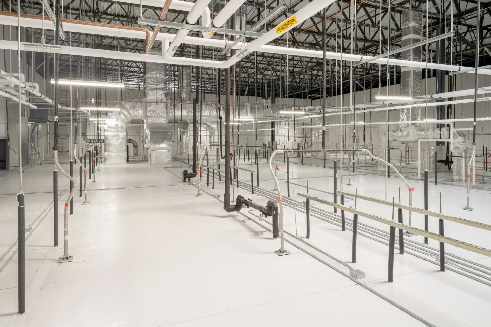 large HVAC area with pipes and tubing